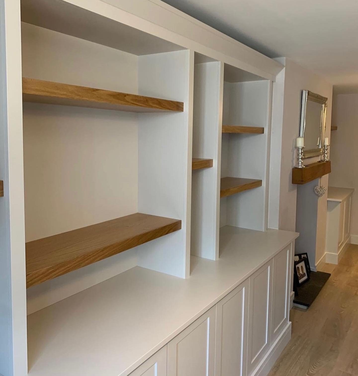 Alcove units sprayed white with oak shelves
