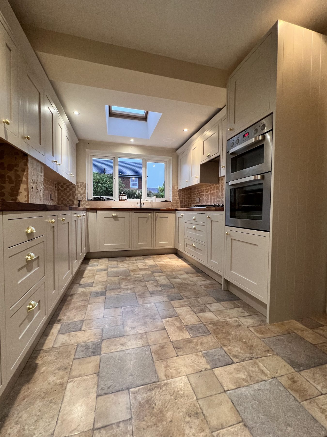 A shaker kitchen resprayed a light stone colour